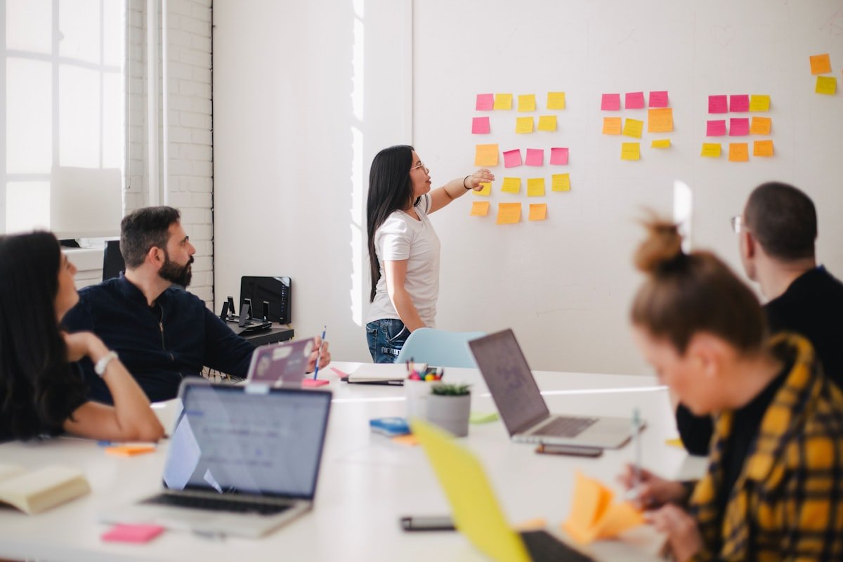 Team collaborating around a table — designing an effective About Us page